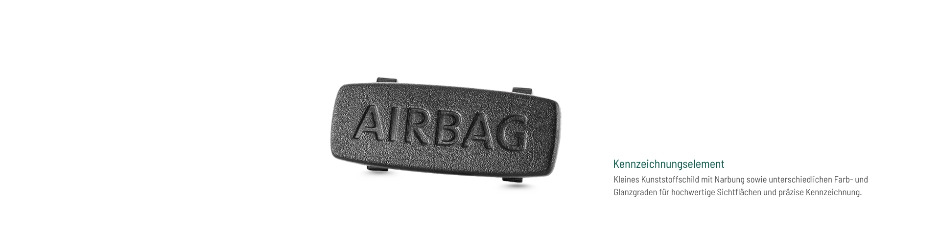 Kunststoff-Kennzeichnungselement mit Narbung und variierendem Glanzgrad, gefertigt von hk für präzise Beschriftung und hochwertige Oberflächen im Innenraum.